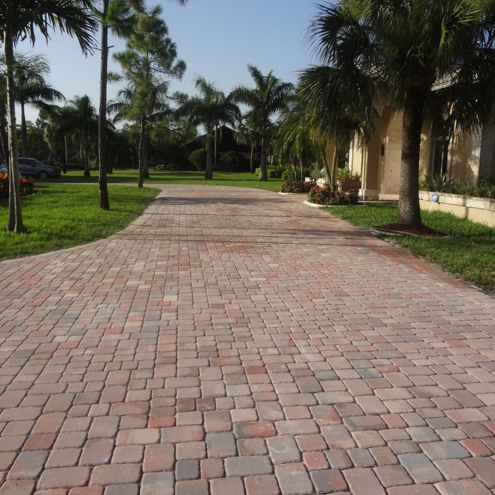 Warm brick paver pool deck installed by F & K Martins Pavers